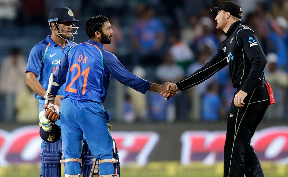 Martin Guptill congratulates Dinesh Karthik after India sealed a six wicket win over the Kiwis at Pune, levelling the three-match ODI series 1-1, with the decider to be played at Kanpur on Sunday. AP Martin Guptill congratulates Dinesh Karthik after India sealed a six wicket win over the Kiwis at Pune, levelling the three-match ODI series 1-1, with the decider to be played at Kanpur on Sunday. AP