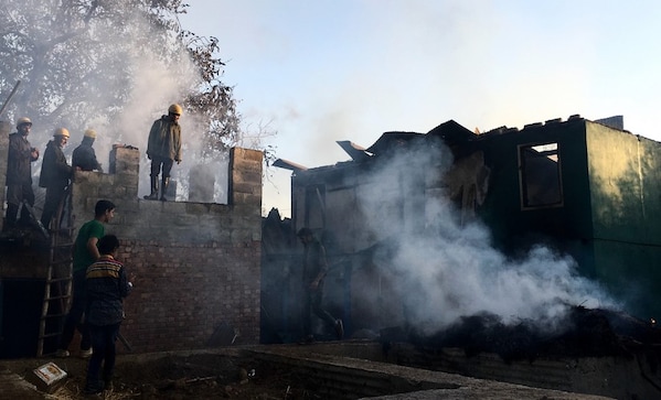 Kashmiris turn on their own: Mob burns down slain PDP worker's house to avenge militant's death Kashmiris turn on their own: Mob burns down slain PDP worker's house to avenge militant's death