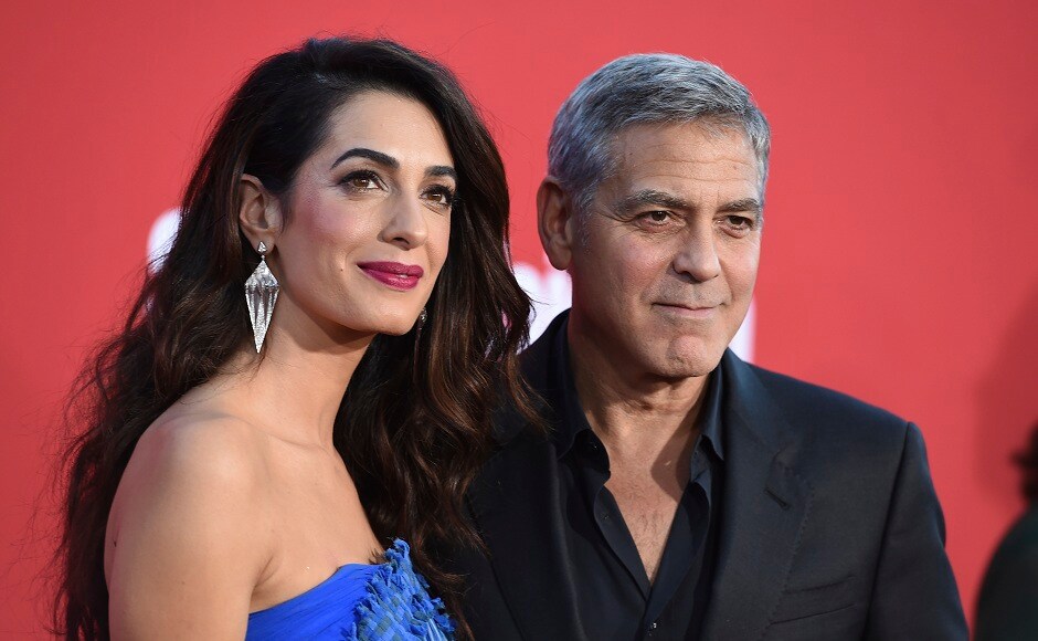 Amal Clooney (left), and George Clooney pose for the photographers at the LA premiere of Suburbicon. Photo by Jordan Strauss/Invision/AP Amal Clooney (left), and George Clooney pose for the photographers at the LA premiere of Suburbicon. Photo by Jordan Strauss/Invision/AP