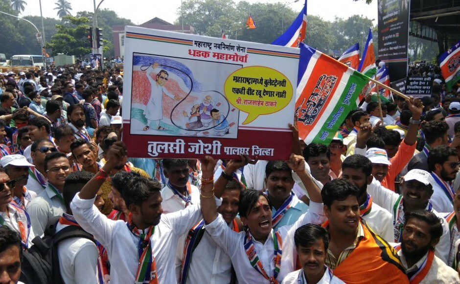 A hoarding showing a cartoon where Raj Thackeray is cracking a whip on Narendra Modi, Devendra Fadnavis and Amit Shah was seen at the rally. Firstpost Raj Thackeray's MNS stages rally in Mumbai days after Elphinstone Road stampede