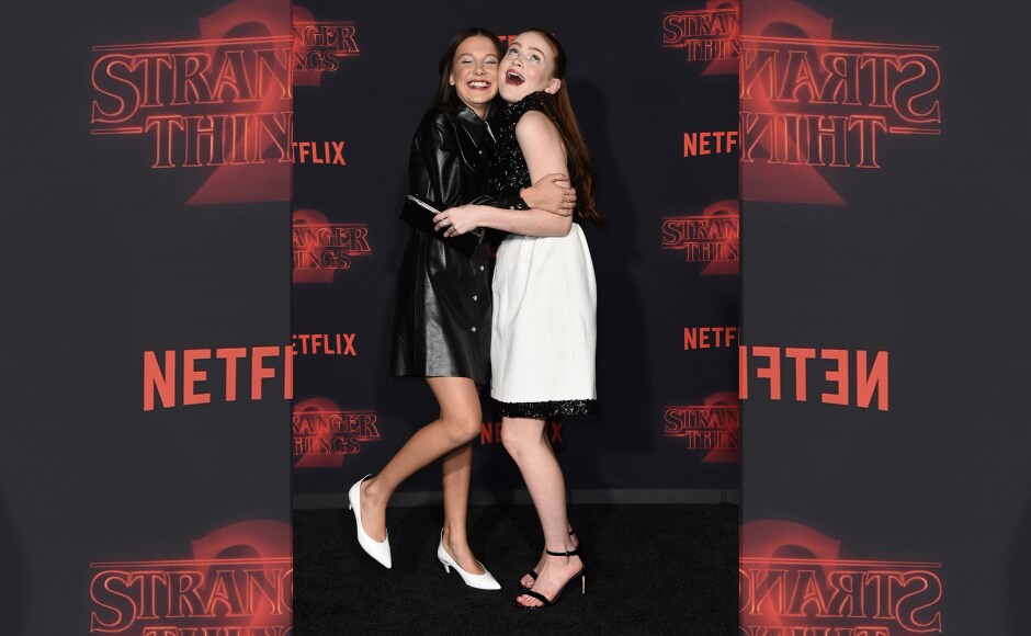 Millie Bobby Brown and Sadie Sink share a light-hearted moment at the premiere. Image from AP. Millie Bobby Brown and Sadie Sink share a light-hearted moment at the premiere. Image from AP.