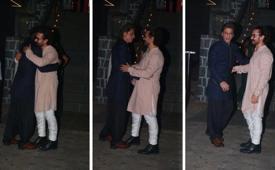Aamir greeted Shah Rukh Khan at the entrance to his home. Photo: Sachin Gokhale/Firstpost Shah Rukh Khan, Sanjay Dutt and Ambanis make a grand entry at Aamir Khan's Diwali bash
