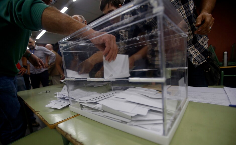 Volunteers, acting as polling station officials, start to count ballots at a polling station in Girona, Spain on Sunday. Volunteers, acting as polling station officials, start to count ballots at a polling station in Girona, Spain on Sunday.