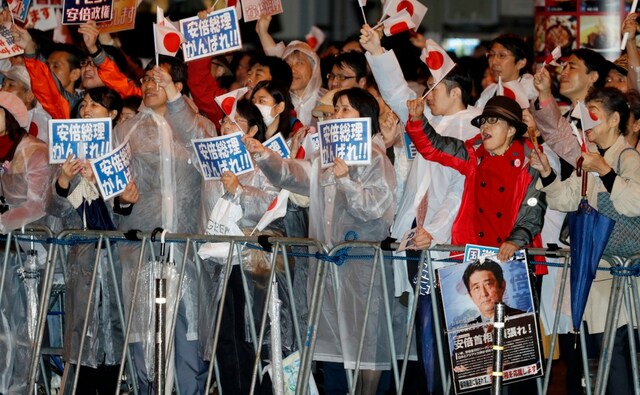 Millions of Japanese braved typhoon condition on Sunday for a snap selection likely to hand Prime Minister Shinzo Abe a fresh mandate to revive the World's third-largest economy. AP Millions of Japanese braved typhoon condition on Sunday for a snap selection likely to hand Prime Minister Shinzo Abe a fresh mandate to revive the World's third-largest economy. AP