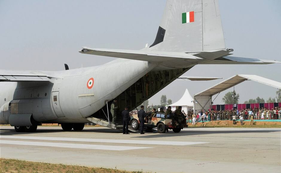 Personnel display skills next to an Indian Air Force Hercules C-130J aircraft that landed on the Lucknow-Agra Expressway, during the drill. PTI Personnel display skills next to an Indian Air Force Hercules C-130J aircraft that landed on the Lucknow-Agra Expressway, during the drill. PTI