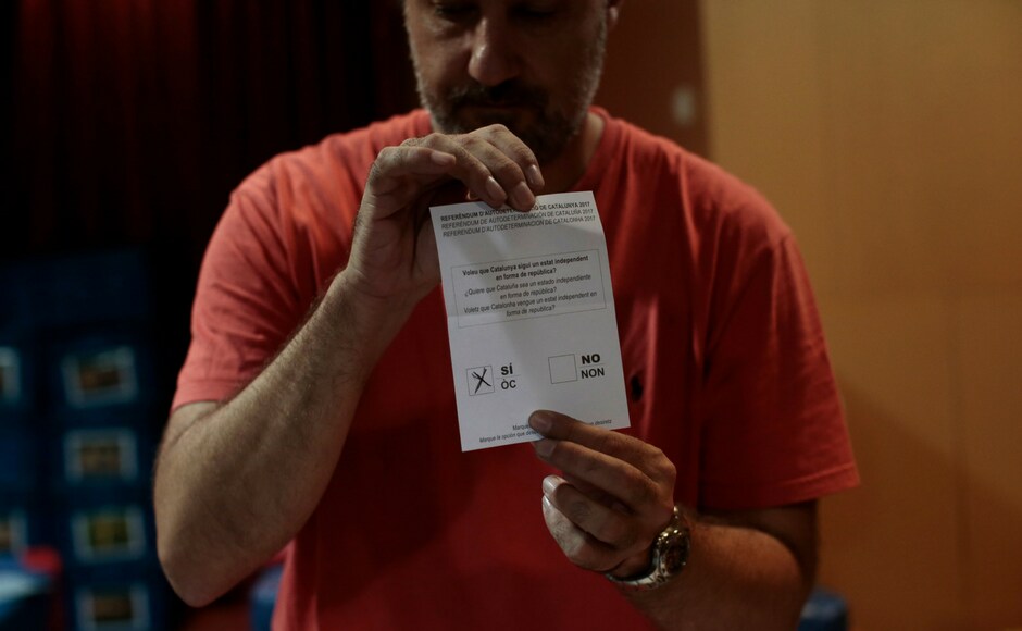 Officials count votes at a school assigned to be a polling station by the Catalan government in Barcelona, Spain on Sunday evening. AP Officials count votes at a school assigned to be a polling station by the Catalan government in Barcelona, Spain on Sunday evening. AP