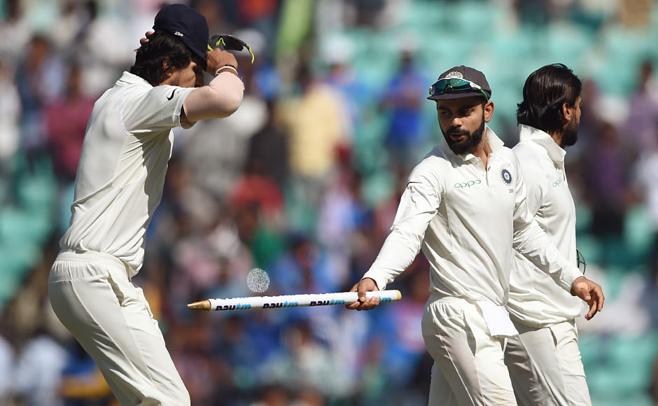 Virat Kohli jokes with Ishant Sharma as they walk back after India won the second Test. AFP Virat Kohli jokes with Ishant Sharma as they walk back after India won the second Test. AFP
