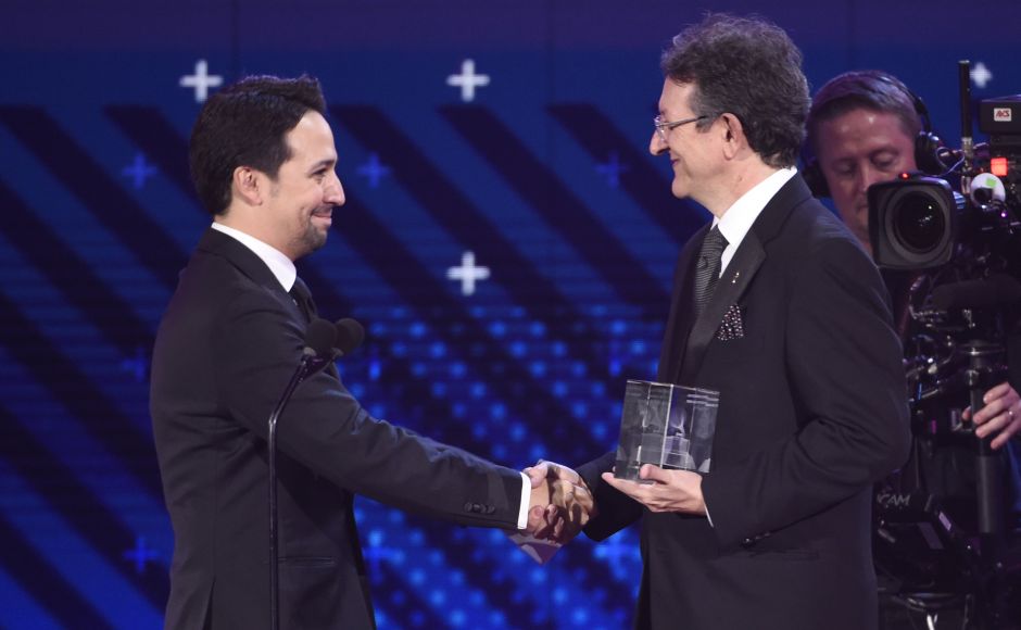Lin-Manuel Miranda, (L) accepts the Latin Recording Academy president's merit award from Gabriel Abaroa Jr., president and CEO of the Latin Recording Academy. AP Lin-Manuel Miranda, (L) accepts the Latin Recording Academy president's merit award from Gabriel Abaroa Jr., president and CEO of the Latin Recording Academy. AP