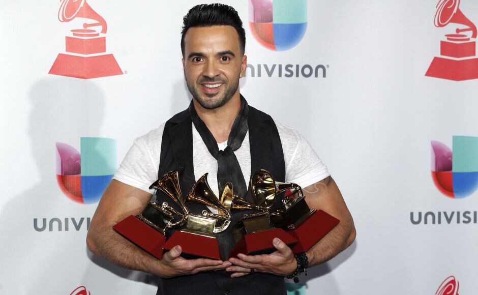 Luis Fonsi poses in the press room with the four awards for his song, "Despacito" at the 18th annual Latin Grammy Awards at the MGM Grand Garden Arena in Las Vegas. AP Luis Fonsi poses in the press room with the four awards for his song, "Despacito" at the 18th annual Latin Grammy Awards at the MGM Grand Garden Arena in Las Vegas. AP