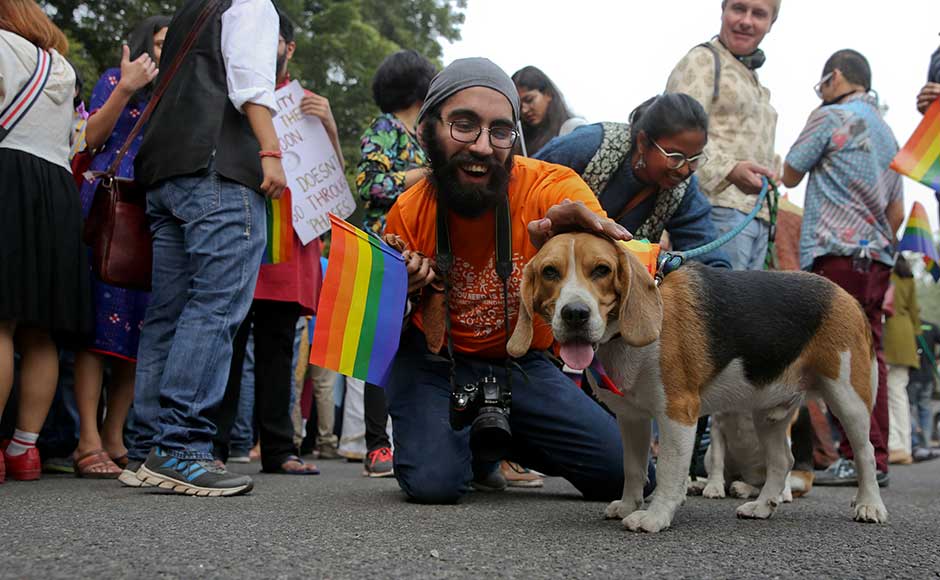 Over the past decade, homosexuals have gained some degree of acceptance in India, especially in big cities. Many bars have gay nights, and some high-profile Bollywood films have dealt with gay issues. A participant poses with a pet dog as gay rights activists and their supporters march during the parade. AP Over the past decade, homosexuals have gained some degree of acceptance in India, especially in big cities. Many bars have gay nights, and some high-profile Bollywood films have dealt with gay issues. A participant poses with a pet dog as gay rights activists and their supporters march during the parade. AP