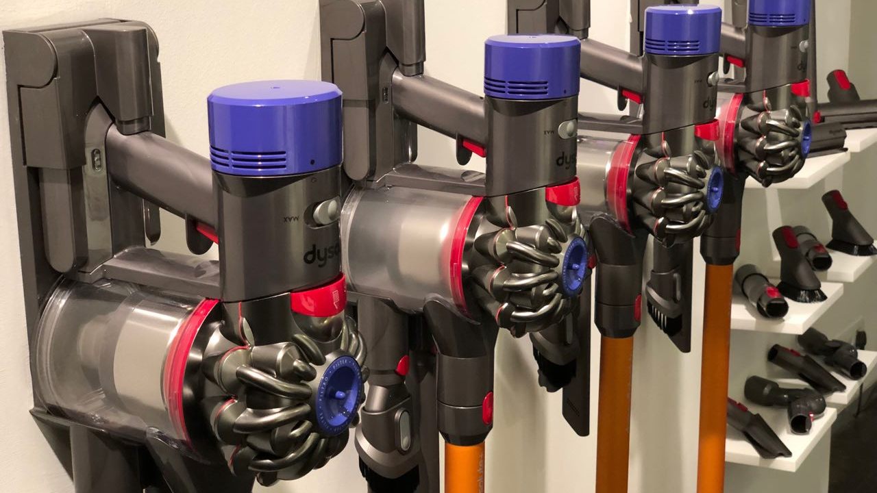 Dyson vacuum cleaners tethered to the charging ports