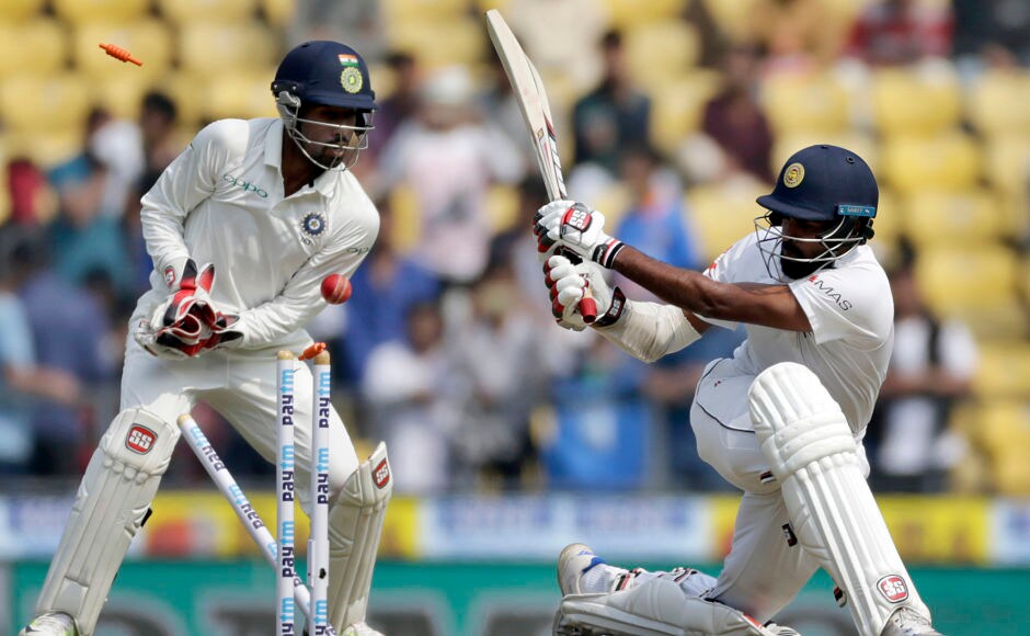 Sri Lanka's Lahiru Thirimanne, right, is bowled out by India's Ravichandran Ashwin during the first day of their second test cricket match in Nagpur. AP Sri Lanka's Lahiru Thirimanne, right, is bowled out by India's Ravichandran Ashwin during the first day of their second test cricket match in Nagpur. AP