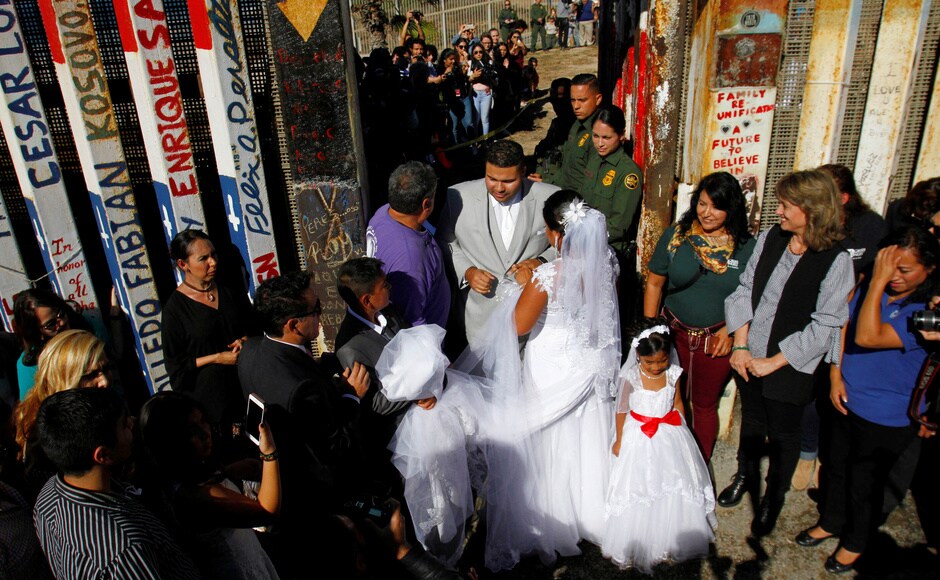 The border patrol guards on 18 November opened a gate along the United States and Mexican border to allow few families who were separated due to deportation, to reunite and converse with each other as a part of 'Opening the Door of Hope'. Reuters The border patrol guards on 18 November opened a gate along the United States and Mexican border to allow few families who were separated due to deportation, to reunite and converse with each other as a part of 'Opening the Door of Hope'. Reuters