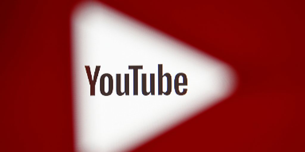 A 3D-printed YouTube icon is seen in front of a displayed YouTube logo in this illustration taken October 25, 2017. REUTERS/Dado Ruvic/Ilustration - RC1BFC9572B0