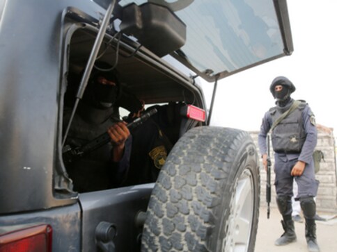 Egypt says troops killed 14 militants, arrested six suspects after Sinai massacre