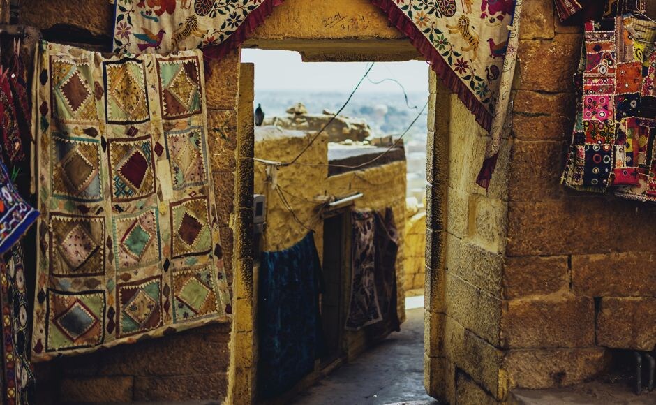 Draped walls and blue skies. Gateways and getaways. Photograph by Harsh Pareek Jaisalmer's majestic havelis and regal temples: A glimpse of the Golden City