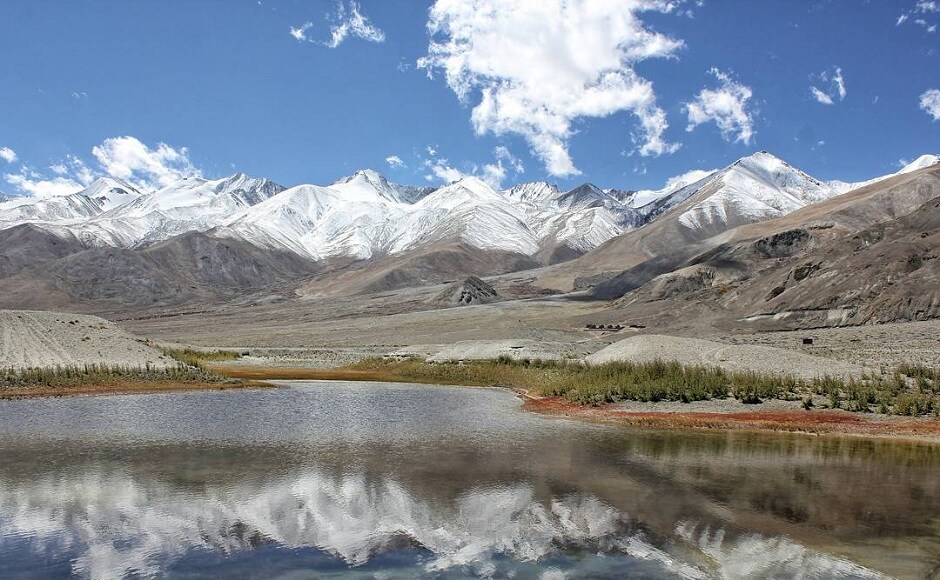 The reflection of snow-clad mountains in the Himalayas in a lake. Image from Instagram/@sidventures From the summit of Machhapuchhare to the Tibetan border, a story of the snow-capped Himalayas