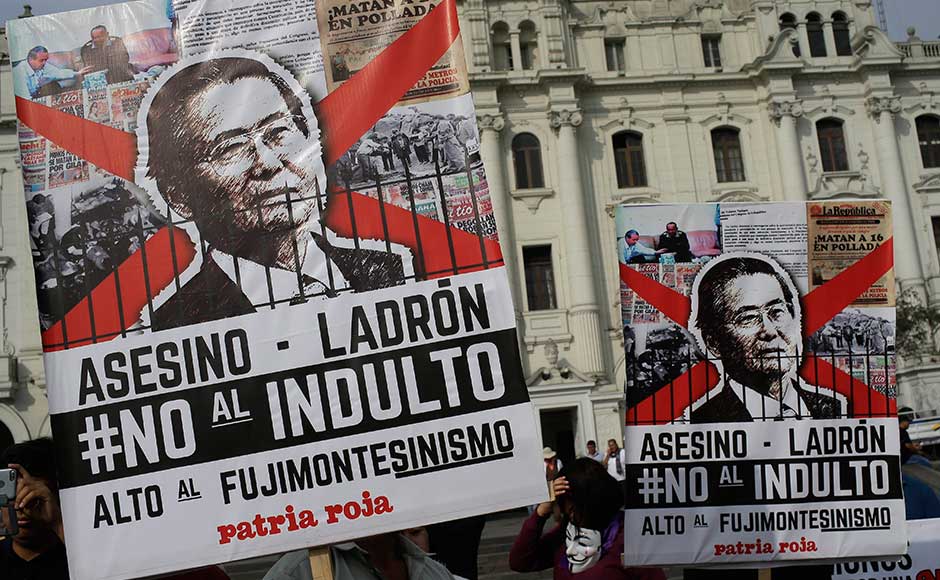 Roughly 5,000 people protested across the country carrying posters with elder Fujimori's face and the words "murderer" and "thief." AP Roughly 5,000 people protested across the country carrying posters with elder Fujimori's face and the words "murderer" and "thief." AP