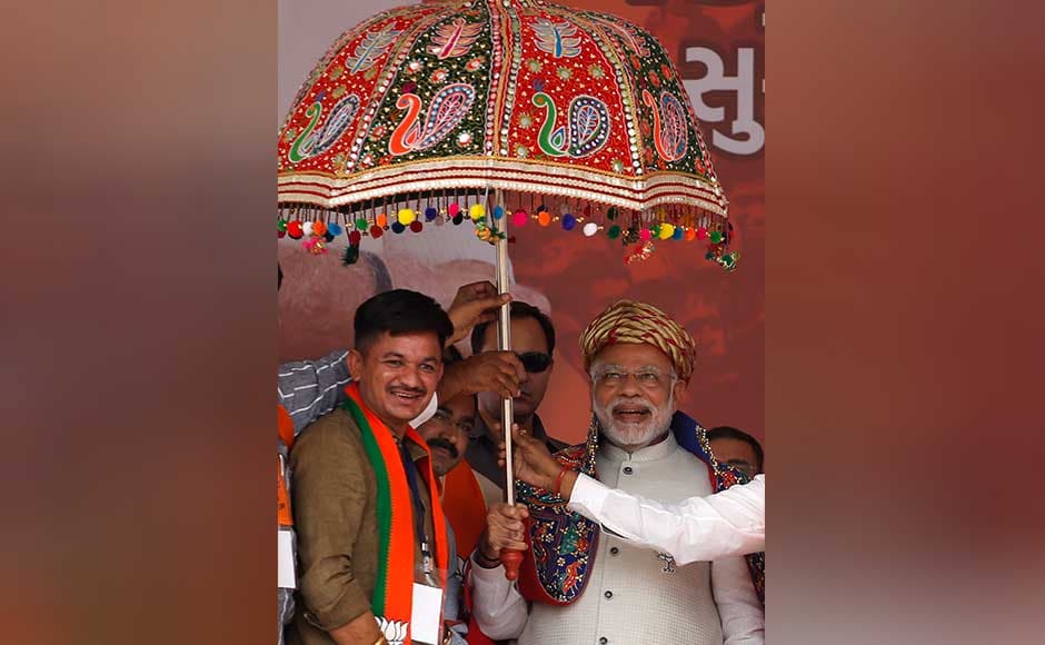 Modi also slammed Congress for not supporting his government over the bullet train project and said, "Those opposing the bullet train project should travel on bullock carts. We won't mind." Modi smiles as he receives a traditional umbrella during an election campaign rally at Surendranagar. AP Modi also slammed Congress for not supporting his government over the bullet train project and said, "Those opposing the bullet train project should travel on bullock carts. We won't mind." Modi smiles as he receives a traditional umbrella during an election campaign rally at Surendranagar. AP