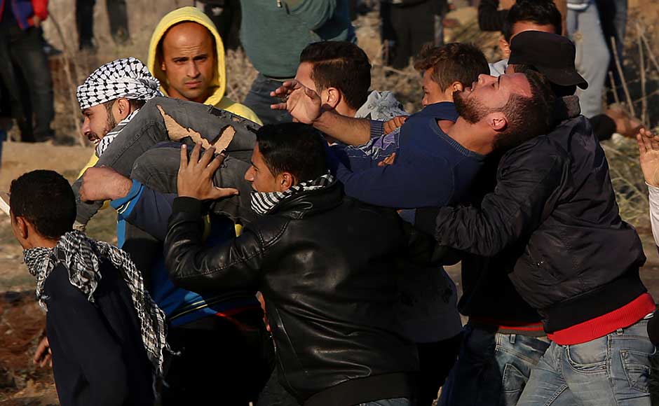 The Palestinians were blindsided by Trump's move to depart from decades of US policy on Jerusalem and upend longstanding international assurances that the fate of the city would be determined in negotiations. Palestinian protesters evacuate a wounded youth during clashes on the Israeli border. AP The Palestinians were blindsided by Trump's move to depart from decades of US policy on Jerusalem and upend longstanding international assurances that the fate of the city would be determined in negotiations. Palestinian protesters evacuate a wounded youth during clashes on the Israeli border. AP