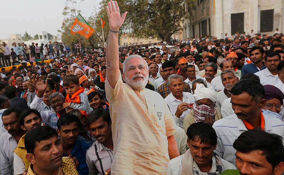 On Monday, the prime minister will be holding public meetings at Valsad, Bhavnagar and Saurashtra. Gujarat will vote in two phases — on 9 and 14 December — to elect a 182-member Assembly. BJP supporters carry a cutout of Modi after a rally in Surendranagar. AP On Monday, the prime minister will be holding public meetings at Valsad, Bhavnagar and Saurashtra. Gujarat will vote in two phases — on 9 and 14 December — to elect a 182-member Assembly. BJP supporters carry a cutout of Modi after a rally in Surendranagar. AP