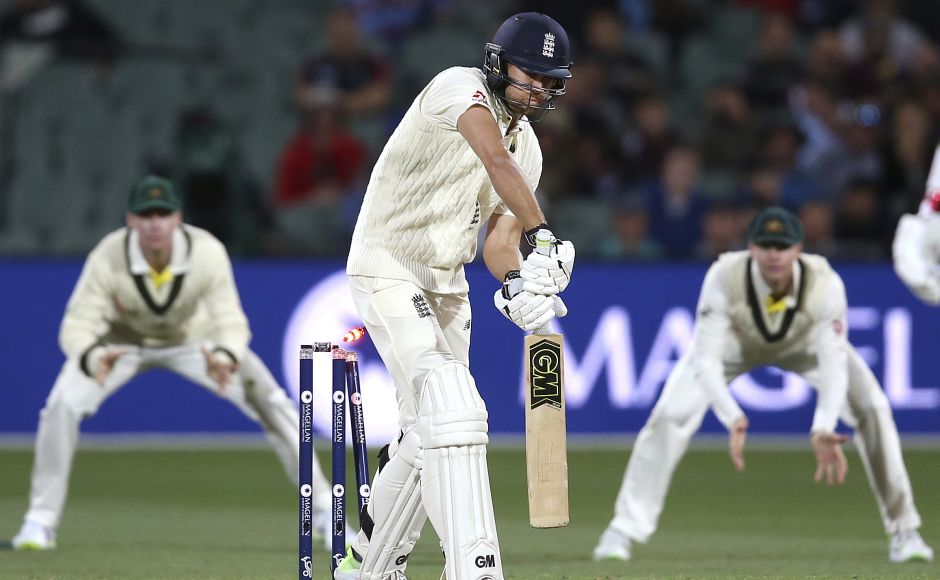 Dawid Malan, center, is bowled for 29 runs by Australia's Pat Cummins, bringing Chris Woakes at the crease for the last few overs. AP Dawid Malan, center, is bowled for 29 runs by Australia's Pat Cummins, bringing Chris Woakes at the crease for the last few overs. AP