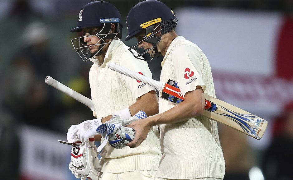 Joe Root, left and Chris Woakes survived the day and here they walk off at stumps, with England now within the reach of a historic victory. AP Joe Root, left and Chris Woakes survived the day and here they walk off at stumps, with England now within the reach of a historic victory. AP