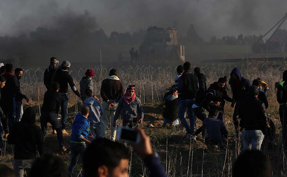 In Ramallah, the seat of the Palestinian government, protesters set tyres on fire, sending thick plumes of black smoke over the city. AP In Ramallah, the seat of the Palestinian government, protesters set tyres on fire, sending thick plumes of black smoke over the city. AP