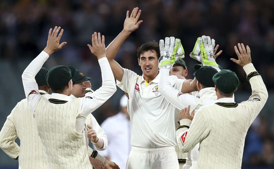 Australia's Mitchell Starc, center, celebrates with teammates after taking the wicket of England's Mark Stoneman, LBW for 18 runs. AP Shaun Marsh's century puts Australia in charge after Day 2 of Ashes 2nd Test