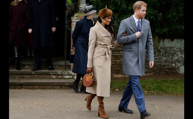 Britain's Prince Harry and his fiancee Meghan Markle walk towards members of the public to greet them following the traditional Christmas Day church service on Monday, 25 December, 2017. AP/Alastair Grant Britain's Prince Harry and his fiancee Meghan Markle walk towards members of the public to greet them following the traditional Christmas Day church service on Monday, 25 December, 2017. AP/Alastair Grant