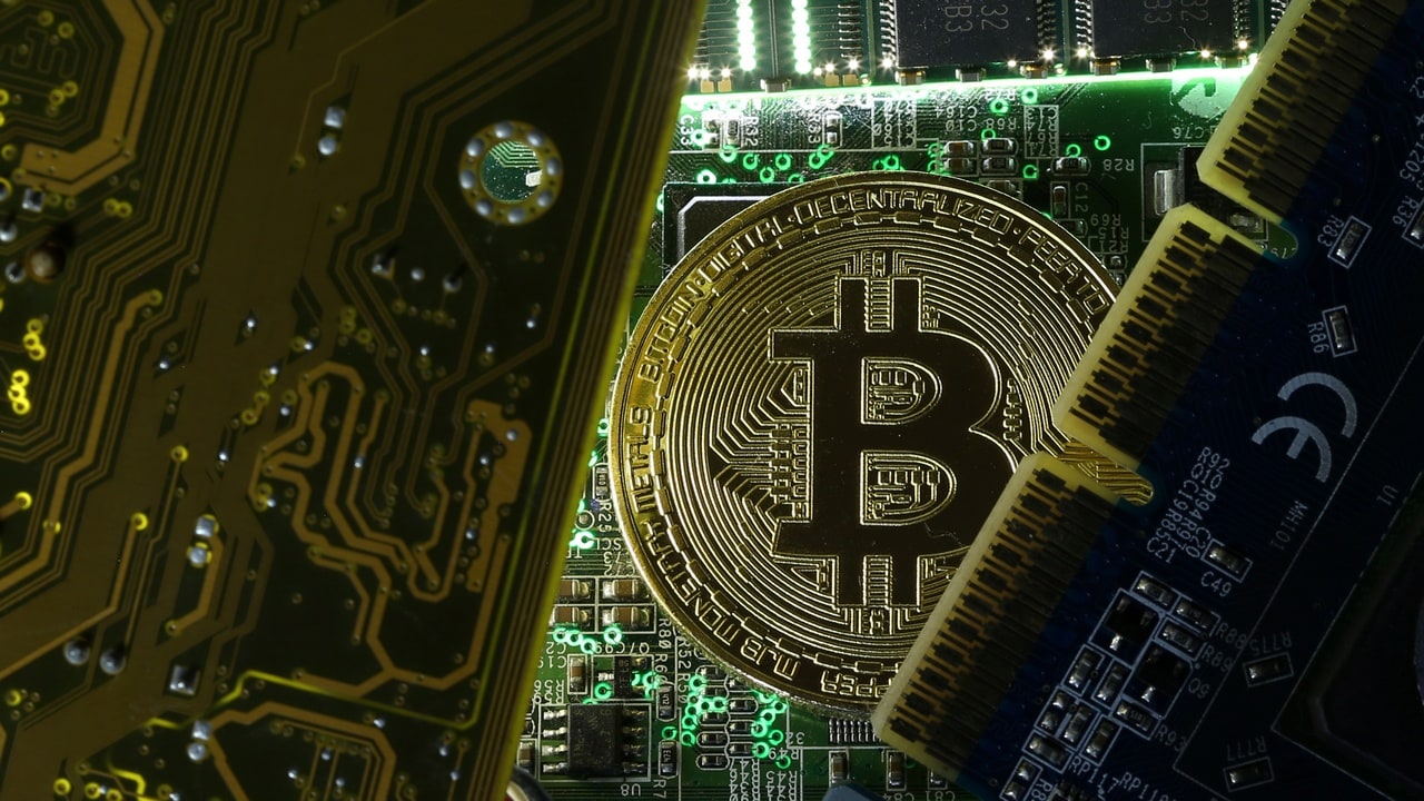 A copy of bitcoin standing on PC motherboard is seen in this illustration picture, October 26, 2017. Picture taken October 26, 2017. REUTERS/Dado Ruvic - RC1ADD827830