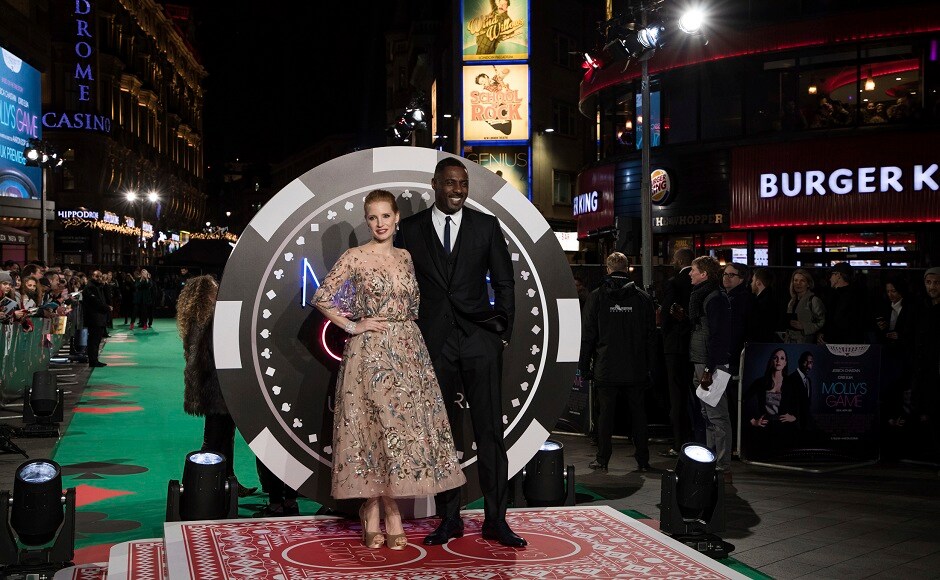 Chastain (left) and Elba pose for photographers. Photo by AP/Vianney Le Caer Chastain (left) and Elba pose for photographers. Photo by AP/Vianney Le Caer
