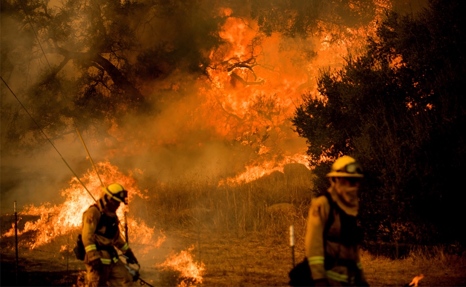 Firefighters light backfire while trying to keep a wildfire from jumping Santa Ana Road near Ventura, California. Brutal winds that fuelled southern California wildfires finally began to ease on Saturday, giving residents and firefighters hope for a respite as the destructive toll of the blazes came into focus. AP Firefighters light backfire while trying to keep a wildfire from jumping Santa Ana Road near Ventura, California. Brutal winds that fuelled southern California wildfires finally began to ease on Saturday, giving residents and firefighters hope for a respite as the destructive toll of the blazes came into focus. AP