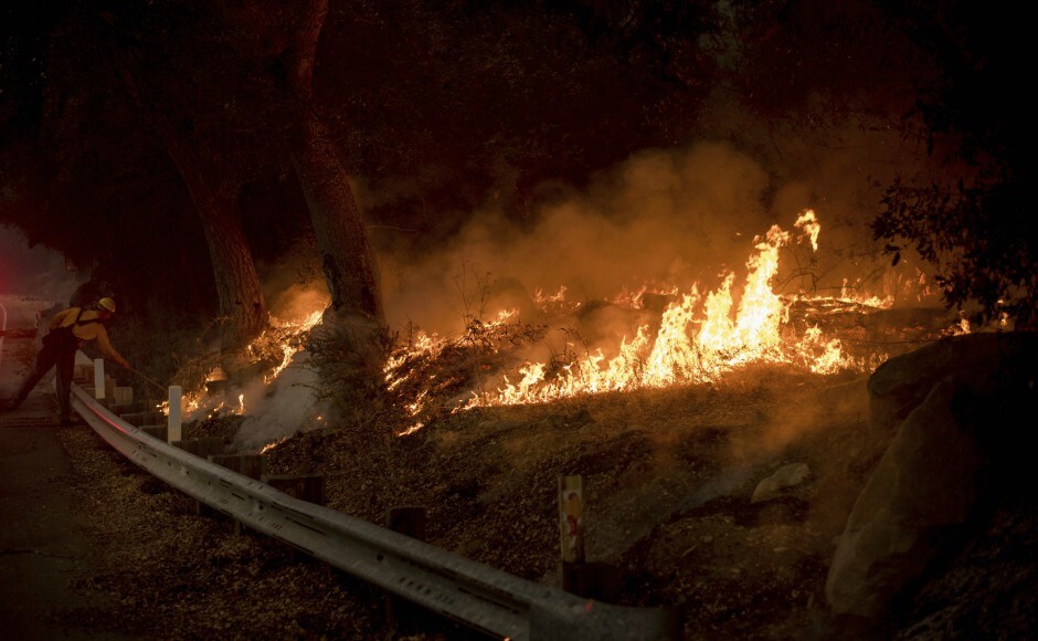 Firefighters gained ground on Friday, and some of the earliest evacuees who fled from flames Monday were being allowed to return home. AP Firefighters gained ground on Friday, and some of the earliest evacuees who fled from flames Monday were being allowed to return home. AP