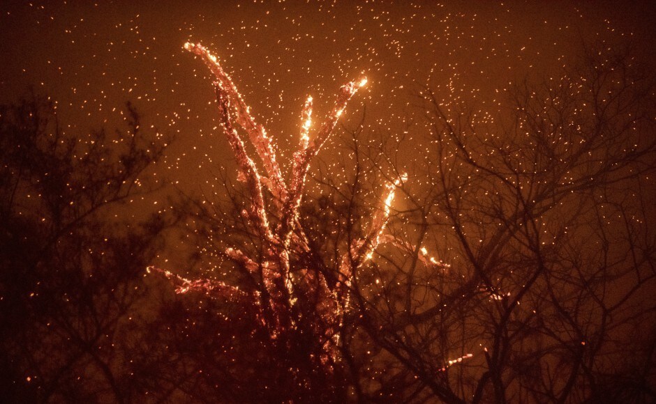 The quick-moving fires that have forced thousands of Californians to evacuate swept across the southern part of the state on Friday, destroying buildings and taxing fire crews. AP The quick-moving fires that have forced thousands of Californians to evacuate swept across the southern part of the state on Friday, destroying buildings and taxing fire crews. AP