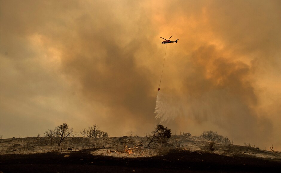 Despite the easing of the winds, meteorologists warned that smoke and ash could linger, prompting several counties to maintain air-quality warnings. US president Donald Trump has issued a state of emergency in California, authorising the release of federal funds. AP Despite the easing of the winds, meteorologists warned that smoke and ash could linger, prompting several counties to maintain air-quality warnings. US president Donald Trump has issued a state of emergency in California, authorising the release of federal funds. AP