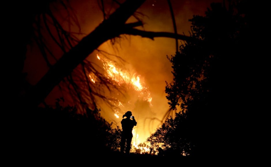 A raging California wildfire powered by fierce winds grew into the third-largest in state history on Saturday as forced evacuations turned neighborhoods into ghost towns and ash fell in some areas like heavy snow. AP A raging California wildfire powered by fierce winds grew into the third-largest in state history on Saturday as forced evacuations turned neighborhoods into ghost towns and ash fell in some areas like heavy snow. AP