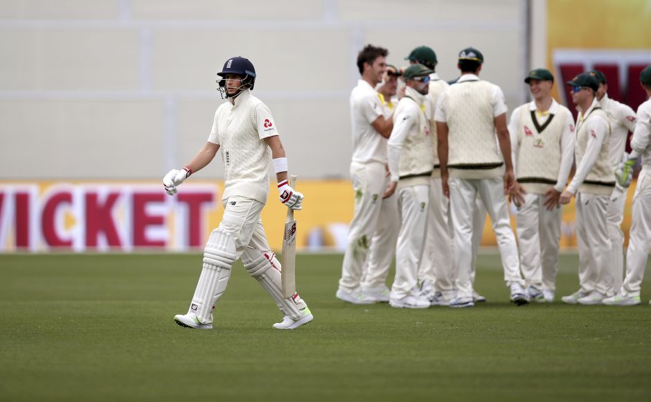 England's Joe Root, left, walks off after he was caught out for eight runs against Australia during the third day. AP England finally fire on Day 3 but Australia still in charge of Ashes 2nd Test