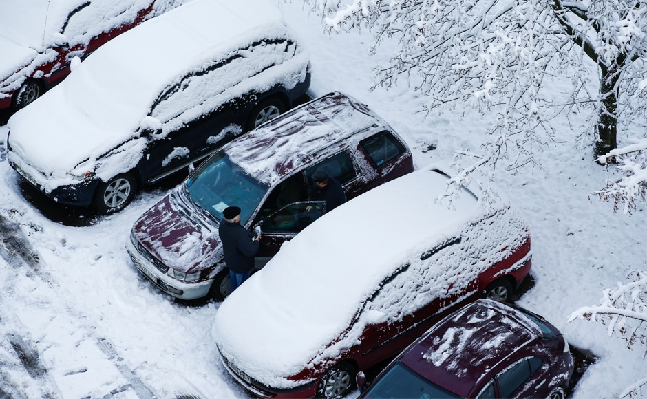 Snow envelopes parked cars in Minsk, Belarus. Power was also cut in several parts of Europe due to gale-force winds. Reuters Snow envelopes parked cars in Minsk, Belarus. Power was also cut in several parts of Europe due to gale-force winds. Reuters