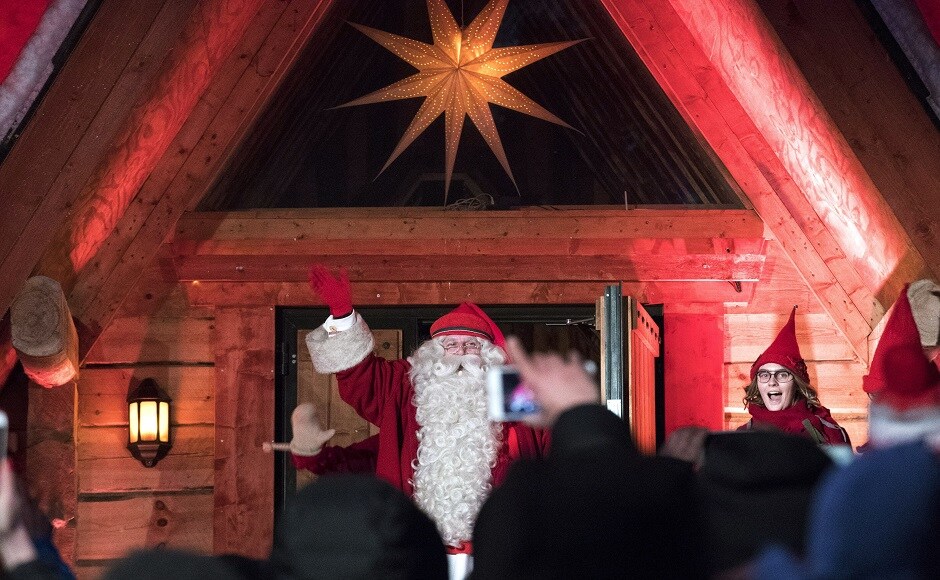 Santa Claus waves to fans as he leaves Santa's Village for his Christmas journey, at the Arctic Circle in Finnish Lapland. AP Christmas around the world: Lights, Santa hats and good cheer mark festivities