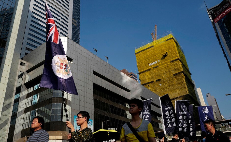 The protesters were led by some of the city's high-profile democracy campaigners, including Joshua Wong. They held Hong Kong's colonial flag during the march. AP Joshua Wong leads 'anti-authoritarian' protest in Hong Kong amidst growing Chinese pressure