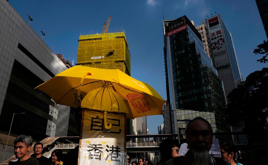 Some protesters carried a yellow umbrella during the march. Their key concerns are jailing of campaigners following court hearings, and fears that Hong Kong will introduce an anti-subversion law. AP Joshua Wong leads 'anti-authoritarian' protest in Hong Kong amidst growing Chinese pressure