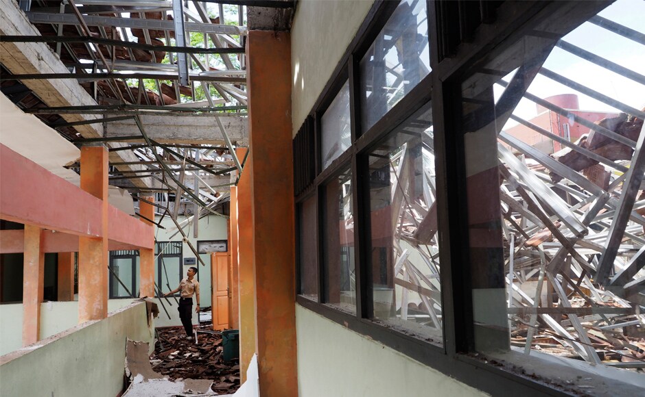 A man inspects the damage at a school building in Tasikmalaya, West Java. At least nine hundred houses were also damaged in addition to schools and government offices across West Java and Central Java provinces. AP A man inspects the damage at a school building in Tasikmalaya, West Java. At least nine hundred houses were also damaged in addition to schools and government offices across West Java and Central Java provinces. AP