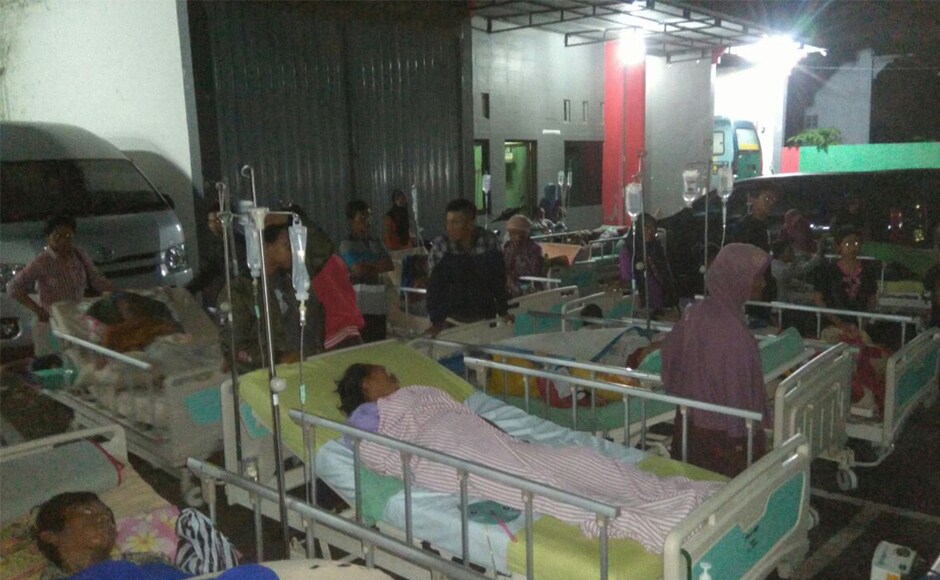 Patients are evacuated outside a hospital in Banyumas, Central Java. The hospital suffered damage to ceilings, cracked walls and leaks to oxygen pipelines, forcing around 70 patients to be moved to temporary shelters. AP Patients are evacuated outside a hospital in Banyumas, Central Java. The hospital suffered damage to ceilings, cracked walls and leaks to oxygen pipelines, forcing around 70 patients to be moved to temporary shelters. AP