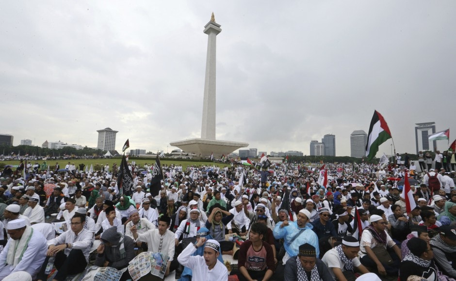 Dressed mostly in white, the demonstrators urged the US to change its decision. AP Dressed mostly in white, the demonstrators urged the US to change its decision. AP