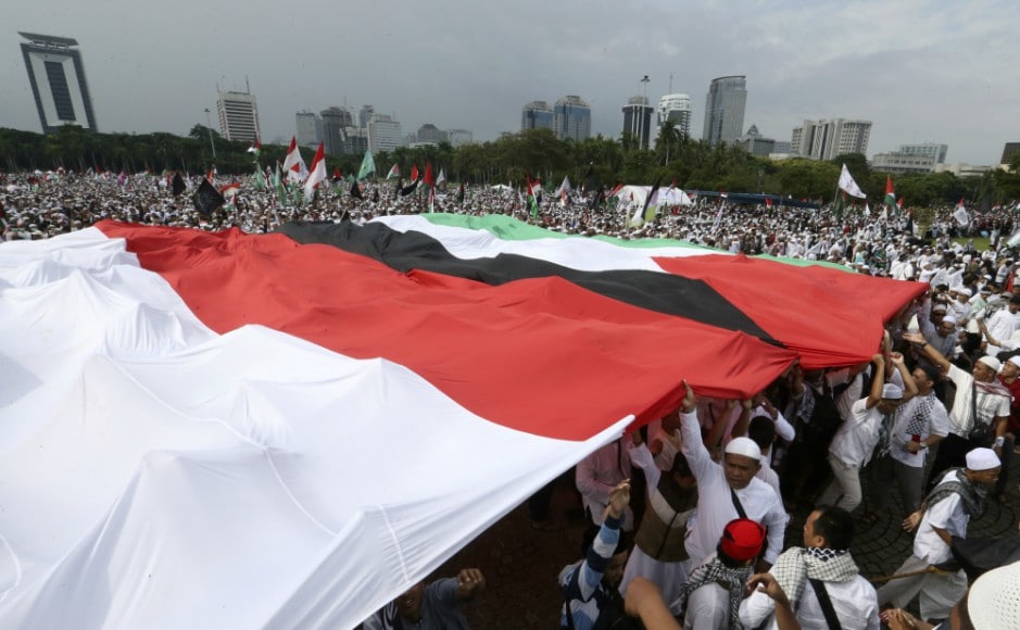 Around 80,000 protesters gathered at the National Monument, a tower that looms over central Jakarta, waving the Palestine flag and banners reading 'Free Palestine'. AP Around 80,000 protesters gathered at the National Monument, a tower that looms over central Jakarta, waving the Palestine flag and banners reading 'Free Palestine'. AP