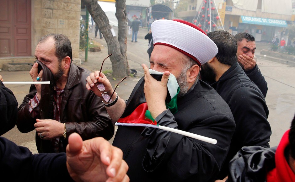 Lebanese security forces fired tear gas and water cannons to repel demonstrators who tried to open the gate by force. Protesters took cover from tear gas fired by riot police. AP Donald Trump's Jerusalem announcement: Security forces use tear gas during protest near US embassy in Lebanon