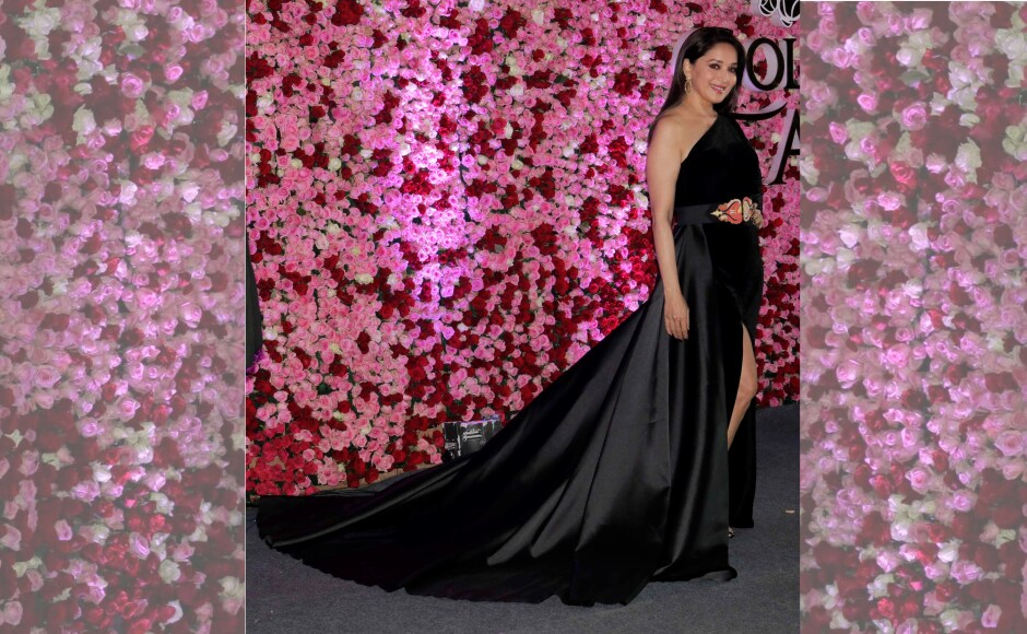 Madhuri Dixit was bestowed with the Timeless Beauty award and she showed us exactly why she received the honour in her sultry black gown. Image by Firstpost/Sachin Gokhale. Madhuri Dixit was bestowed with the Timeless Beauty award and she showed us exactly why she received the honour in her sultry black gown. Image by Firstpost/Sachin Gokhale.