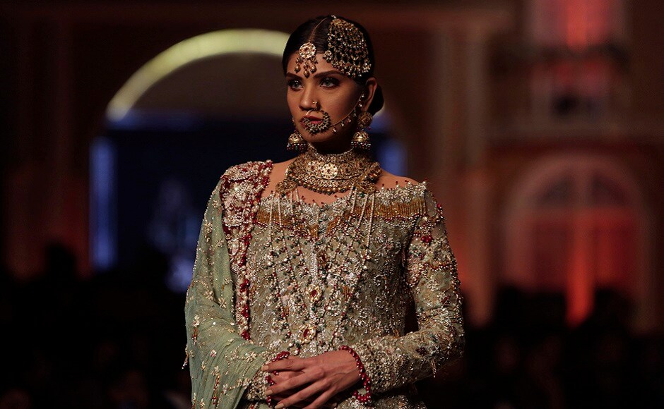 A model presents a creation by designer Uzma Babar during the Pantene Hum Bridal Couture Week in Lahore, Pakistan. AP Photo A model presents a creation by designer Uzma Babar during the Pantene Hum Bridal Couture Week in Lahore, Pakistan. AP Photo