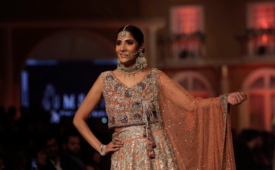 A model presents creation by designer Uzma Babar during the Pantene Hum Bridal Couture Week in Lahore, Pakistan. AP Photo A model presents creation by designer Uzma Babar during the Pantene Hum Bridal Couture Week in Lahore, Pakistan. AP Photo